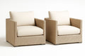 Set of 2 woven resin armchairs with beige cushions