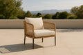 Garden armchair in rattan and fabric with beige cushion